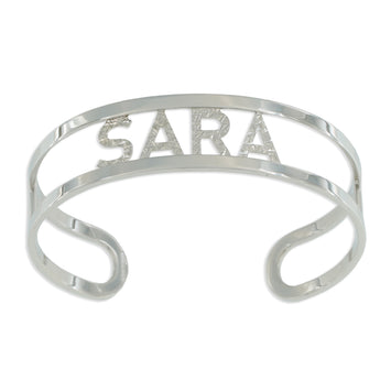 Bracciale aperto in argento rodiato con lettere o simboli Rodiati